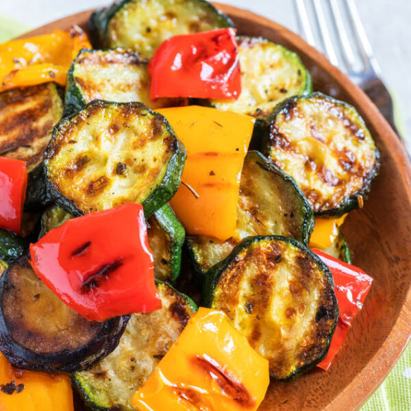 Delicious grilled vegetables salad with zucchini, eggplant, onions, peppers and herbs